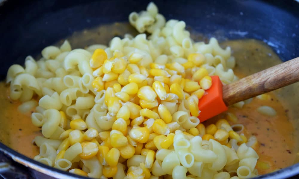 Mixing of Baked Mac and Cheese with Corn